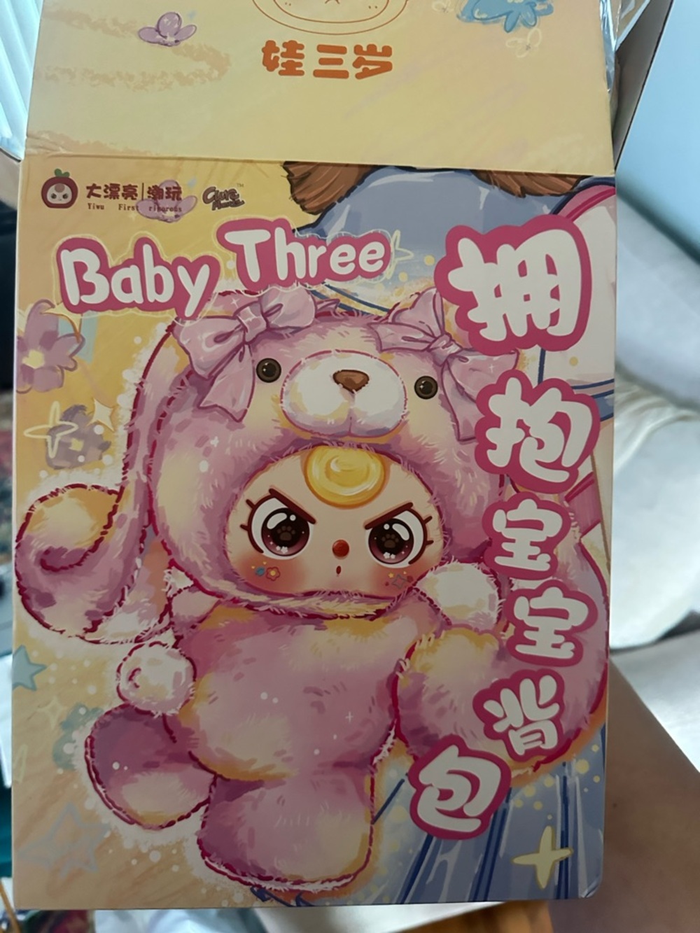 Baby three backpack with pacifier and crying eyes
